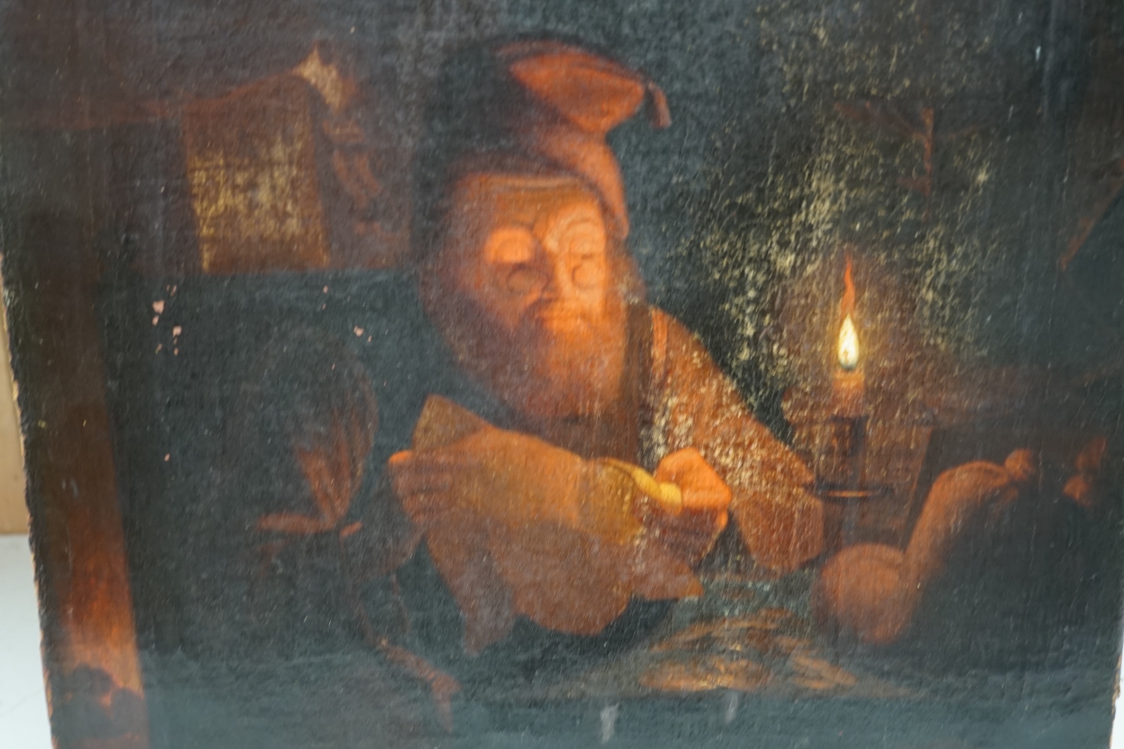 After Godfried Schalcken (Dutch, 1643-1706), oil on canvas, Gentleman reading by candlelight, unsigned, 44 x 37cm, unframed. Condition - poor to fair